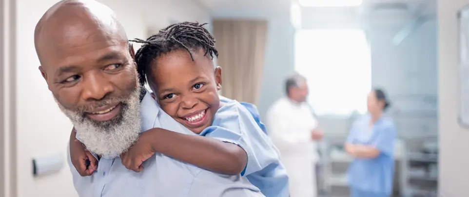 father-giving-piggyback-to-son-in-hospital