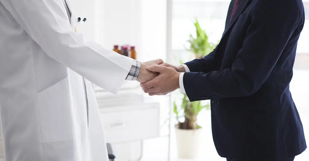 doctor-and-businessman-are-shaking-hands