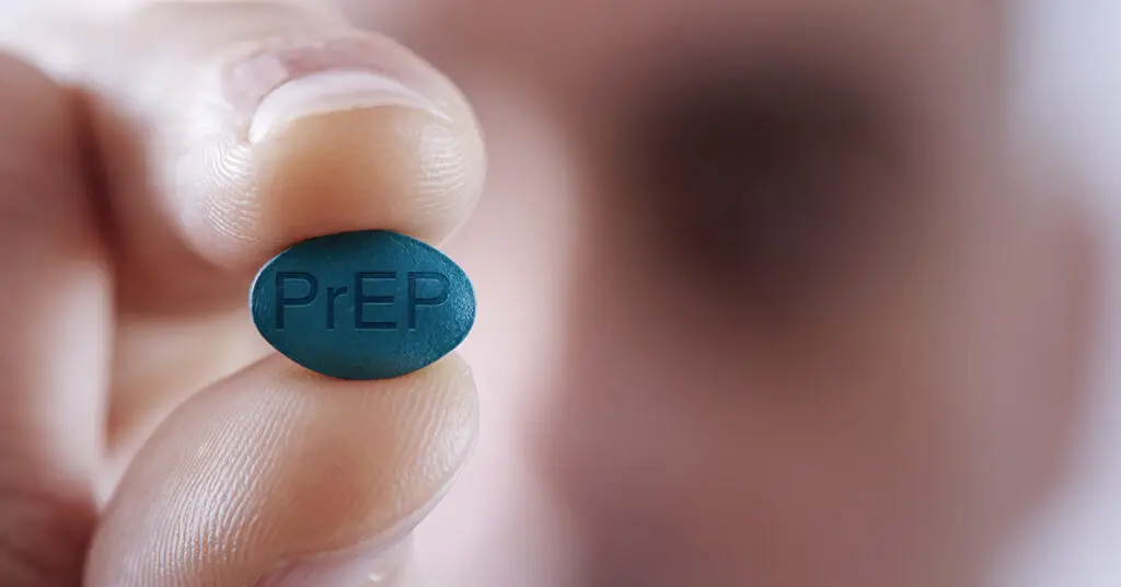 closeup-of-a-young-caucasian-man-with-a-simulated-prep-pill-in-his-hand