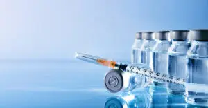 vials-group-and-syringe-on-table