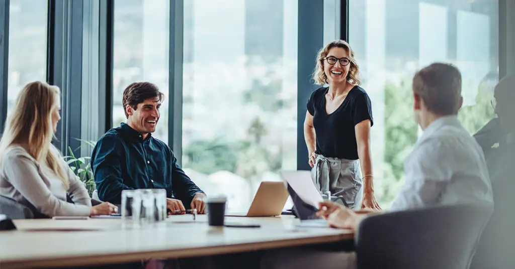 office-colleagues-having-casual-discussion-during-meeting-in-conference-room