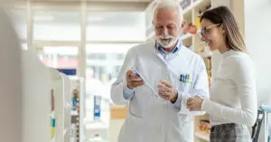 older-pharmacist-assisting-a-patient