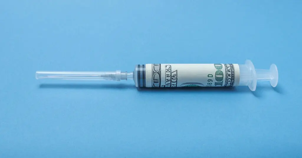 syringe-wrapped-in-dollar-inflation-reduction