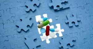 puzzle-pieces-drug-capsules-strategy-drug-development-process