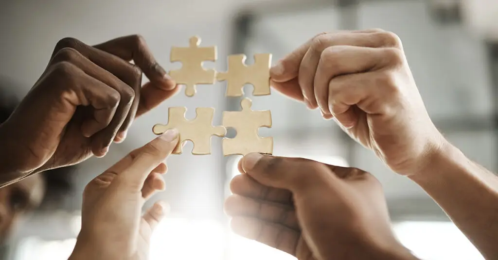 diverse-hands-connecting-puzzle-pieces-global-companies-coming-together